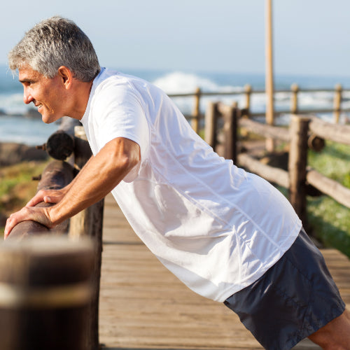 Man exercising at the beach