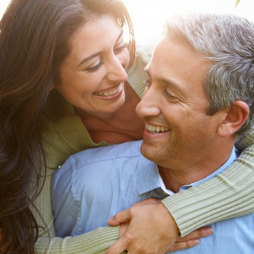 Smiling man and woman hugging