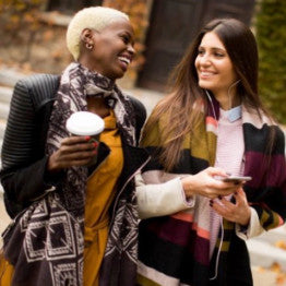 Two woman chatting and drinking coffee