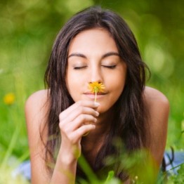 Girl smelling a flower