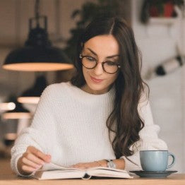 Woman concentrating reading a book