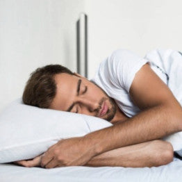 Man asleep in bed