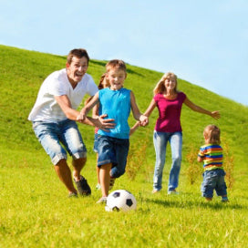 Family playing football