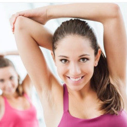 A woman exercising smiling