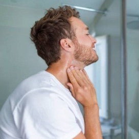 Man massaging his neck