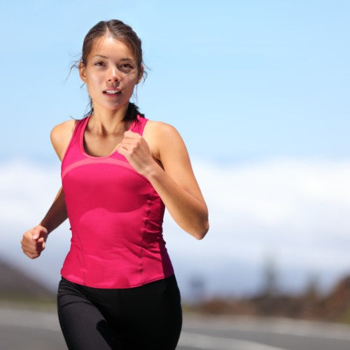 Woman in red vest jogging