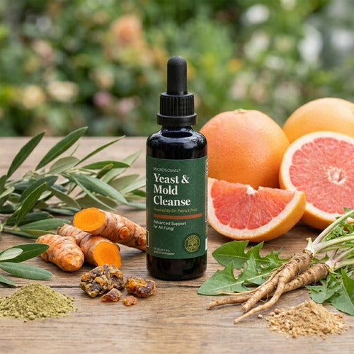 Bottle of Yeast & Mold Cleanse supplement with fruits and herbs on a wooden surface
