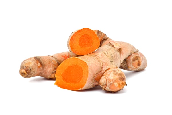 Turmeric root on a white background