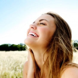Woman smiling into the sun