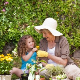 Woman and young girl gardening