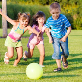 Children chasing a ball