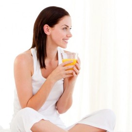 Woman sat drinking juice