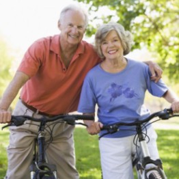Older man and woman cycling